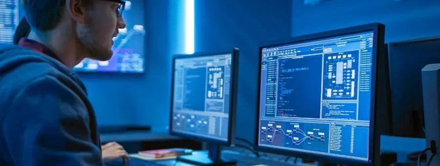 man with glasses using computer