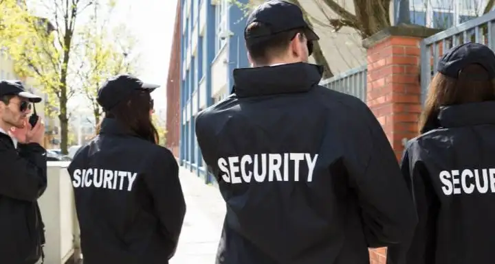 four security guards on patrol
