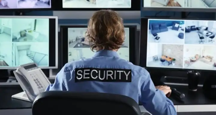 security guard looking at computer screens