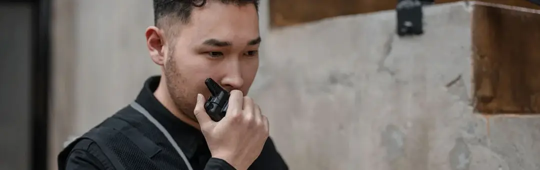 security guard on walkie talkie